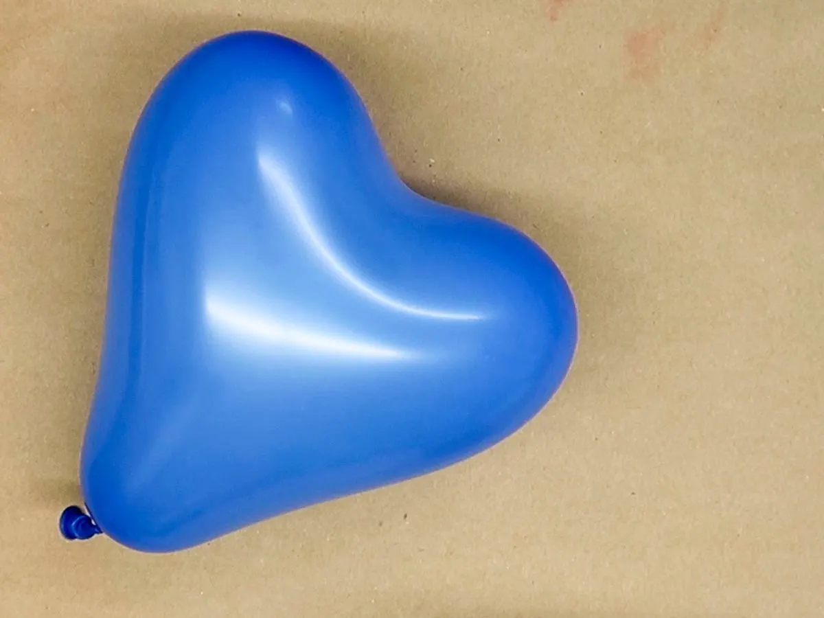 Inflated heart-shaped balloon which will become the base for making DIY Twine Hearts.