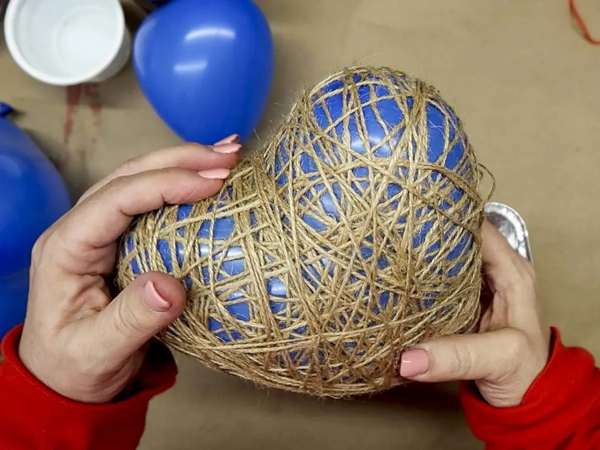 Heart-shaped balloon covered in dry twine.